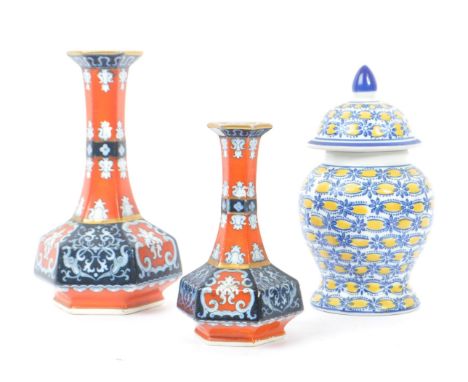 Two vintage 20th century various sized hexagonal shaped china bud vases. Together with a blue and yellow lidded ginger jar wi