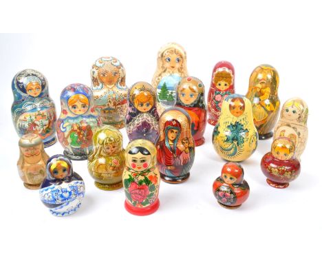 A collection of late 20th century and later Russian USSR folk art Matryoshka graduating nest of dolls. With ornate hand paint