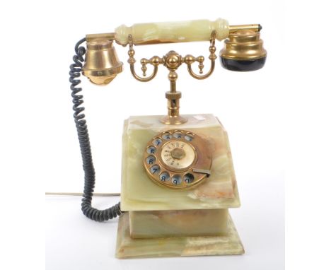 A vintage 20th Century circa. 1930s marble onyx and brass telephone with rotary dial and cord to handset. The bottom upon a s
