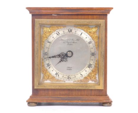 Gerrard &amp; Co. Ltd Elliott London - A 20th Century oak mantle clock of square form with silver face and black roman numera