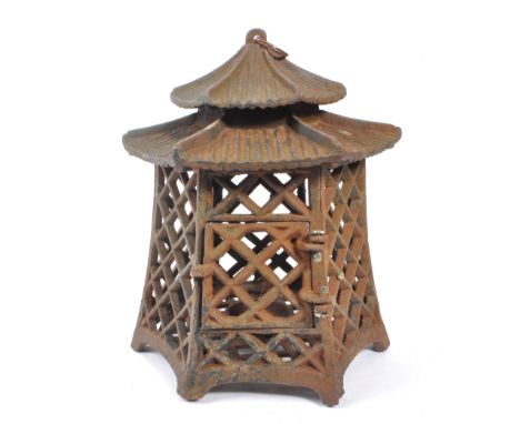 A 19th century cast iron Japanese pagoda candle holder / lantern. Comprising of a two tiered hexagonal roof with ring top, pi