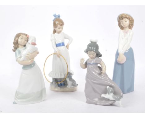 Nao - A collection of four china porcelain Nao figures to include young girl with puppy, young girl holding lamb, young girl 