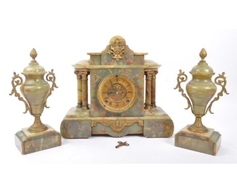 A 19th Century marble onyx eight day movement mantle clock garniture, having circular gilded metal dial face with visible esc