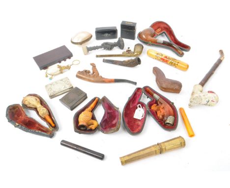 A collection of vintage 19th century and 20th century smoking pipes to include carved wooden example, porcelain meerschaum pi