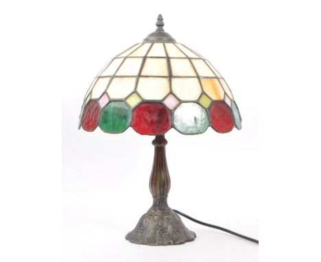 Tiffany style - A 20th Century tiffany style bistro desk / table lamp of domed form having green and red stained glass. The b