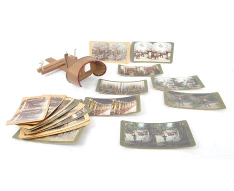 A vintage 20th Century circa. 1970s Stereoscope viewer accompanied by a collection of slides depicting various scenes in Japa