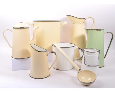 A collection of vintage 20th century kitchen enamel ware. Including barrel / soup pot, water jugs, kettle, and ladle. Tallest