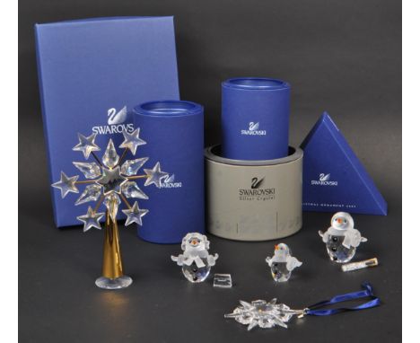 Swarovski - A collection of Swarovski crystal Christmas ornaments and figures. The collection to include three snowman figure
