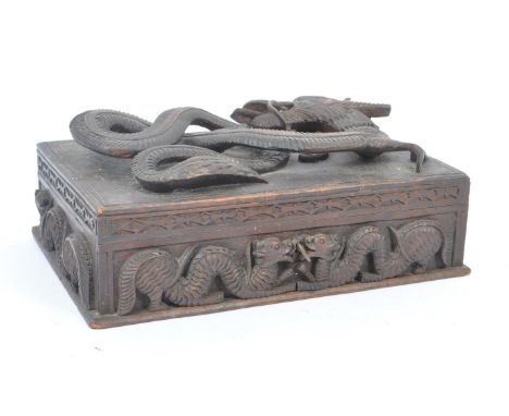 A vintage 20th century Asian oriental Chinese dragon stationary box. With carved relief dragon detail to hinged lid, interior