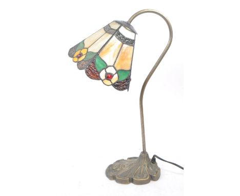 A vintage Art Nouveau style Tiffany table lamp light. Stain glass style with lead shade, curved metal support arm, finished w