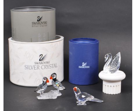 Swarovski - A collection of three boxed Swarovski crystal bird figures. The collection to include a parrot figure ( 294047 ),