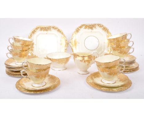 Hammersley &amp; Co - A vintage 20th Century china porcelain tea service by Hammersley &amp; Co having cream ground with gilt