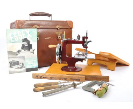 Essex - A vintage mid 20th century Essex miniature sewing machine. The machine held within a leather hinged box, alongside a 
