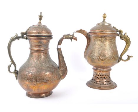 Two early 20th century Indian / Tibetan water / kettle copper and brass jugs. With embossed decoration with foliate relief. p