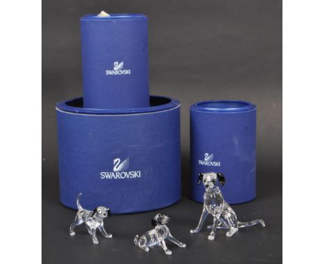 Swarovski - A collection of boxed Swarovski crystal dog figure ornaments. The collection to include a series of three dalmati