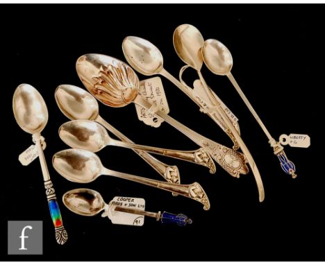 A collection of Arts &amp; Crafts spoons, to include an enamelled figural topped spoon, length 12cm, Birmingham 1917, Liberty