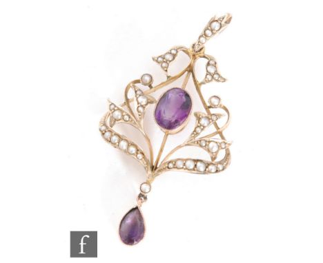 An Edwardian 9ct amethyst and seed pearl open work pendant with pearl set scroll decoration, terminating in amethyst drop, le