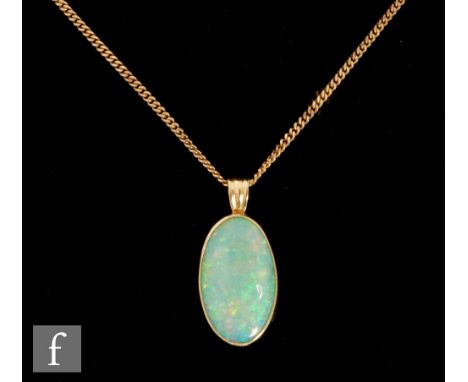 An 18ct mounted oval single stone simulated opal pendant, length 20mm, suspended from a 9ct curb chain, total weight 6g, leng