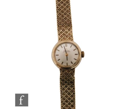 A lady 9ct hallmarked Omega automatic wrist watch, batons to a circular silvered dial and integral fitted 9ct woven bracelet,