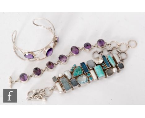 Two modern silver stone set bracelets to include an amethyst and turquoise coloured stone example, with a three stone silver 