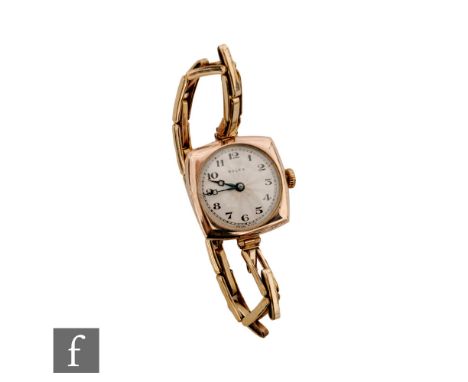 A lady's 9ct hallmarked Rolex manual wind wrist watch, Arabic numerals to a sunburst silvered dial within a 25mm square case,