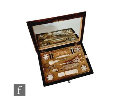 A 19th Century Palais Royal sewing box fitted with mother of pearl tools to include scissors, scent flask and thread winders,