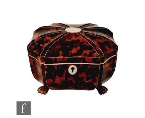 A 19th Century tortoiseshell sarcophagus tea caddy with laid mother of pearl escutcheon and cartouche, raised on carved bone 