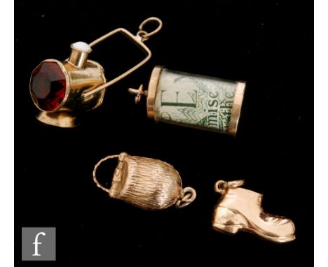 Four 9ct gold charms, comprising a boot, a £1 note, a Busby and a miner's lamp, total weight 3.6g. (4) 