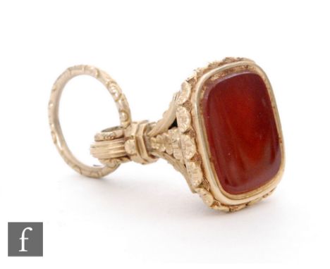 A 19th Century 15ct seal fob with plain carnelian stone to acanthus leaf decoration and large split ring, weight 16g. 