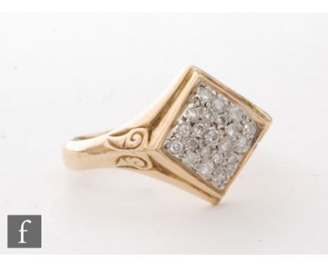 An 18ct hallmarked gentleman's diamond ring, pave set off set square head to scroll detailed shoulders, ring size T. 