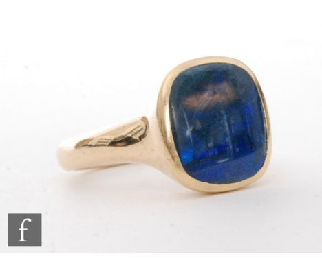 An 18ct hallmarked signet ring set with a single cushioned rectangular opal, length 13mm, weight 9.5g, ring size N 1/2, Birmi