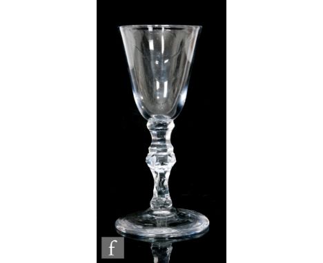 An 18th Century glass goblet circa 1790, the round funnel Dutch bowl diamond point stipple engraved with cupid about to fire 