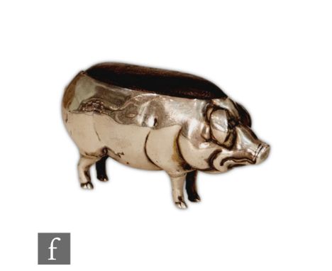 A silver hallmarked pin cushion modelled as a standing pig, Birmingham 1905, Cohen &amp; Charles, height 3.5cm, length 6cm. 