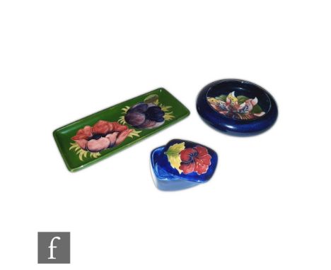 Three pieces of Moorcroft comprising a Frilled Orchid pattern roll rim bowl, diameter 12.5cm, S/D, a rectangular pen tray in 