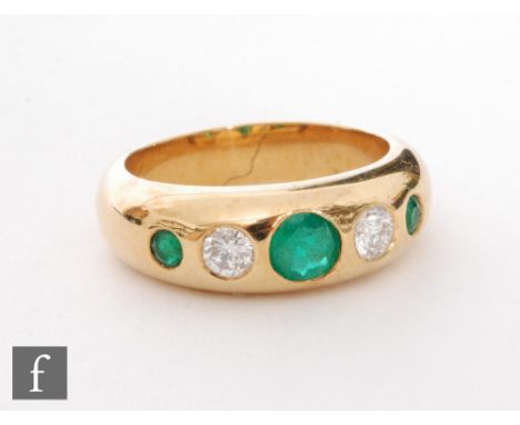 A modern 18ct hallmarked emerald and diamond five stone ring, alternate gypsy set stones to a plain shank, ring size R. 