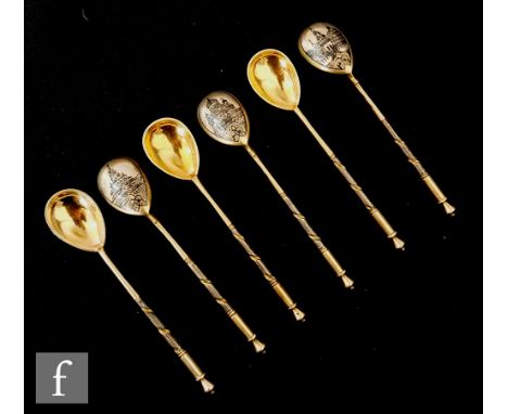 A collection of 19th Century Russian silver-gilt Neillo topographical teaspoons, the bowl of each with varying architectural 