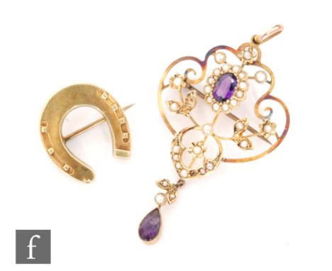 An Edwardian 9ct amethyst and seed pearl open work pendant, terminating in an amethyst drop, length 5.5cm, weight 4.5g, with 