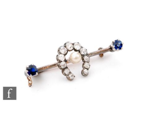 An early 20th Century 9ct bar brooch with central single pearl within a diamond set horseshoe and a single sapphire to each t