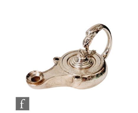 A Victorian hallmarked silver ink well modelled as an Aladdin's lamp with part engraved decoration and terminating in eagle h