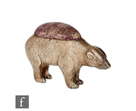 A silver hallmarked pin cushion modelled as a standing polar bear, Birmingham 1906, Cohen &amp; Charles, height 4.5cm, length