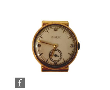 An 18ct hallmarked gentleman's Jaeger-Le Coultre manual wind wrist watch with Arabic numerals and batons to a silvered dial, 