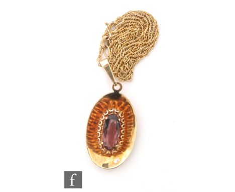 A 9ct hallmarked pendant with central claw set amethyst stone to a plain mount, length 45mm, suspended from a 9ct trace chain