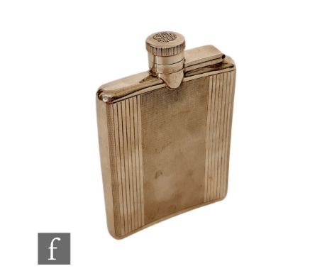 A hallmarked silver rectangular hip flask with engine turned decoration below bayonet cap, cap engraved with initials, length