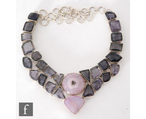 A silver, amethyst and rose quartz necklet with twenty five irregular collar set amethysts and two central quartz, length 46c