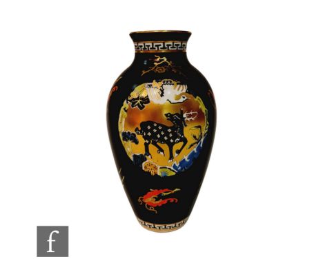 An early 20th Century Royal Worcester shape 2472 baluster vase decorated in the Aesthetic taste with a roundel with a black s