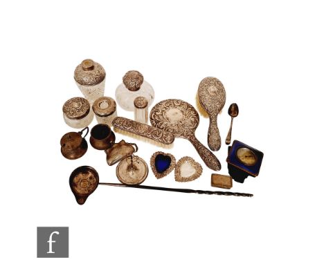 A parcel lot of assorted hallmarked silver items to include dressing table bottles, brushes, a toddy ladle, a cruet set, a pl