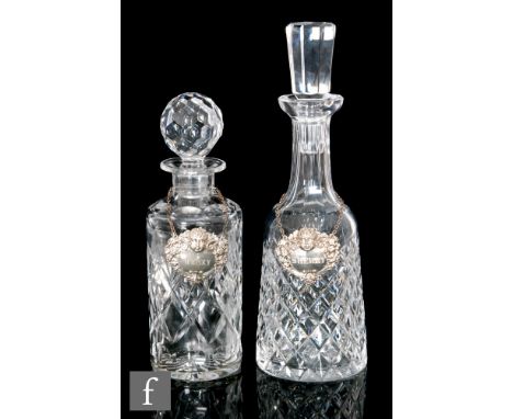 A Waterford glass decanter of mallet form with diamond cut pattern below a faceted cut neck and conforming stopper, acid mark