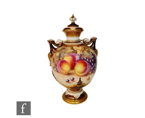 A large Royal Worcester Fallen Fruits shape 1691 twin handled vase decorated in the round by H. Ayrton with hand painted peac