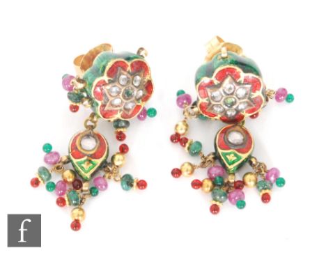 A pair of paste set enamel decorated earrings, possibly Indian, with green and red enamel above tassel stone set drops, lengt