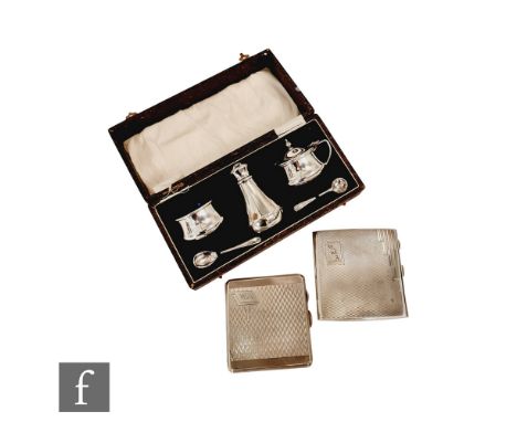 A cased hallmarked silver three piece cruet set of plain form with two engine turned cigarette cases, total weight of silver 